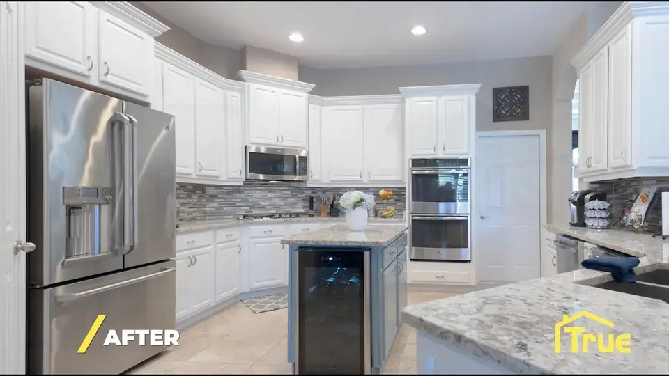 Finished kitchen with new white cabinets and granite countertops by True Builders, the work we do for Davenport FL homeowners