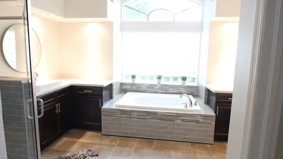 Tampa bathroom rebuilt by True Builders with a new shower, cabinets, and flooring