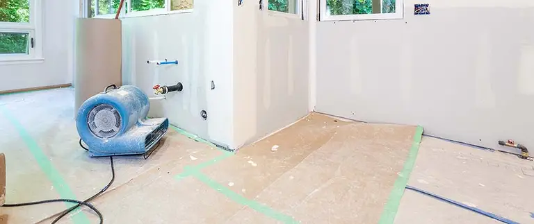Water damaged hardwood floors requiring restoration — True Builders blog