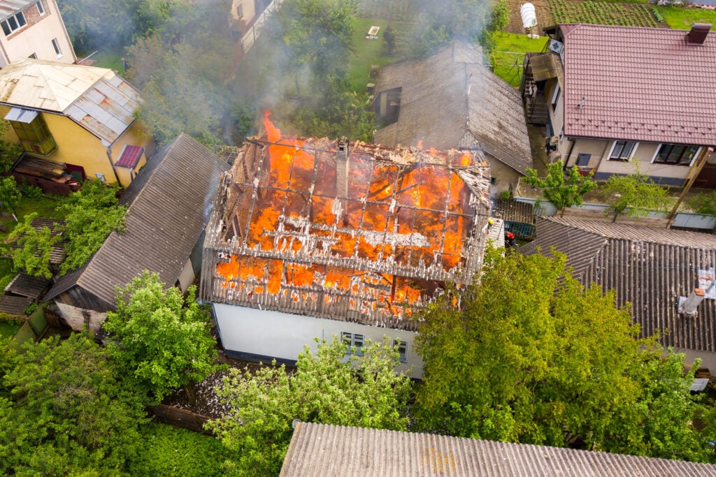 Hand pulling fire alarm for emergency response in Central Florida business – fire safety plan example.